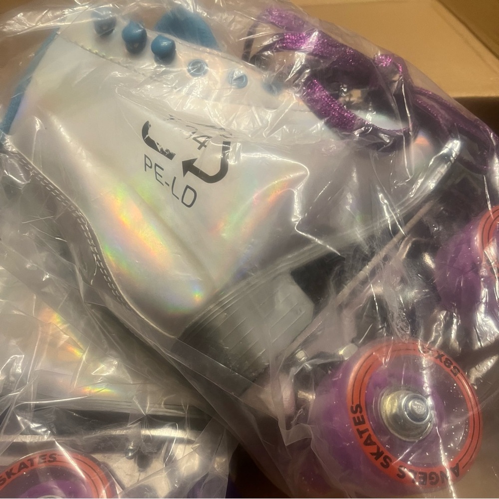 Holographic Roller Skates with Purple Wheels. Kids girl size one.